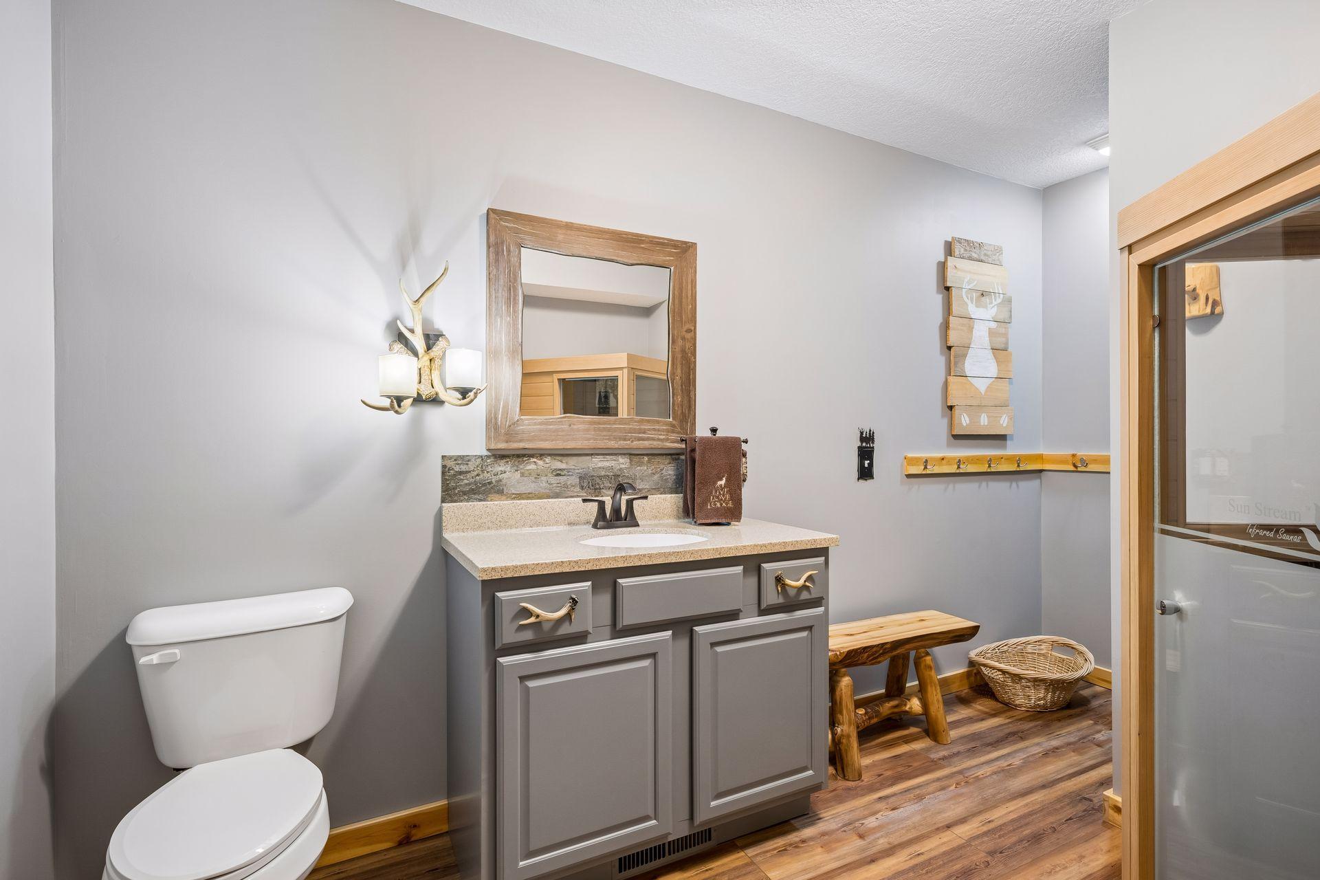 Lower-level bathroom with current sauna that will be taken by the seller. Around the corner is a large walk in shower.
