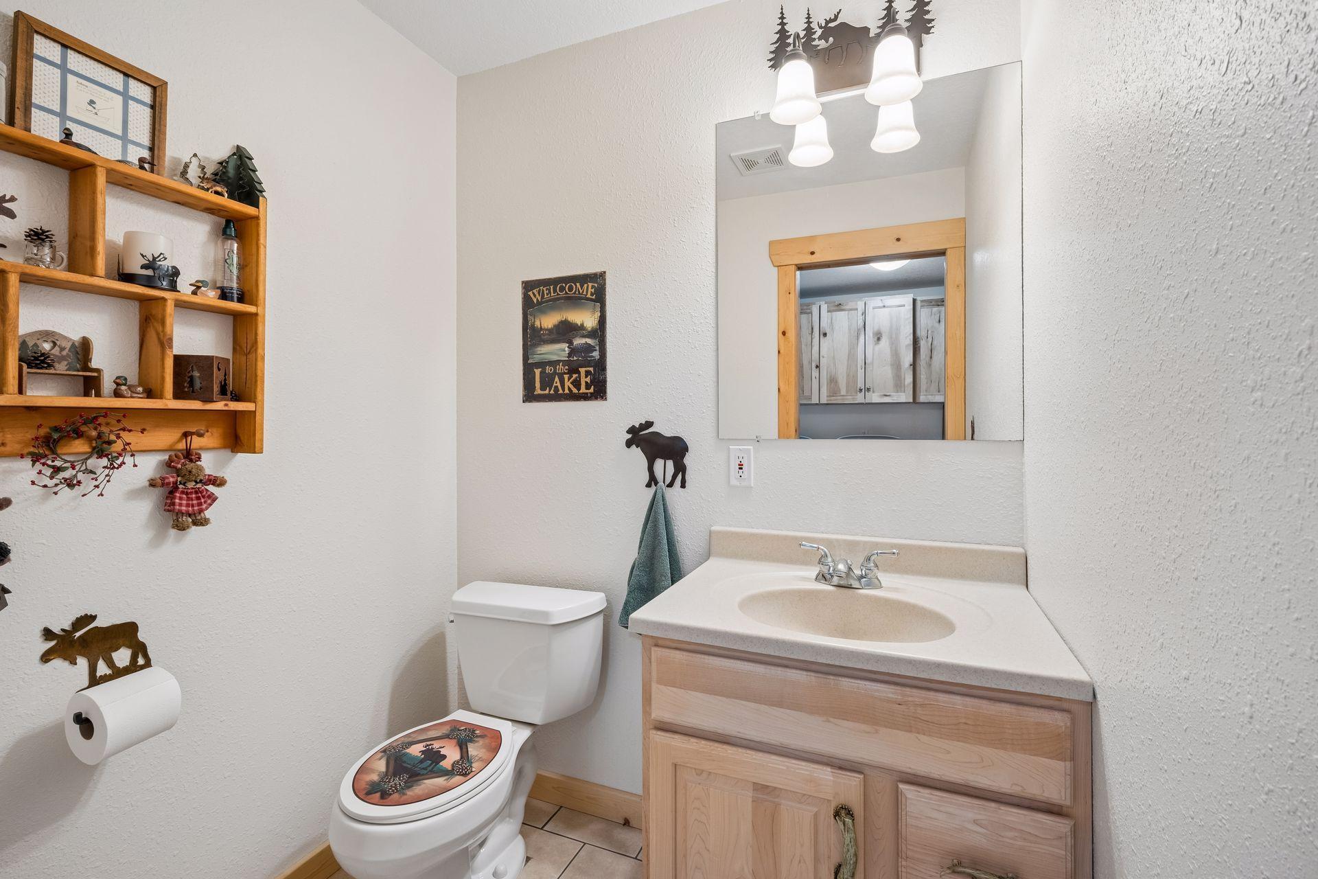 Tiled half powder bath off back entry and drop zone from the garage for nice privacy on the main level.