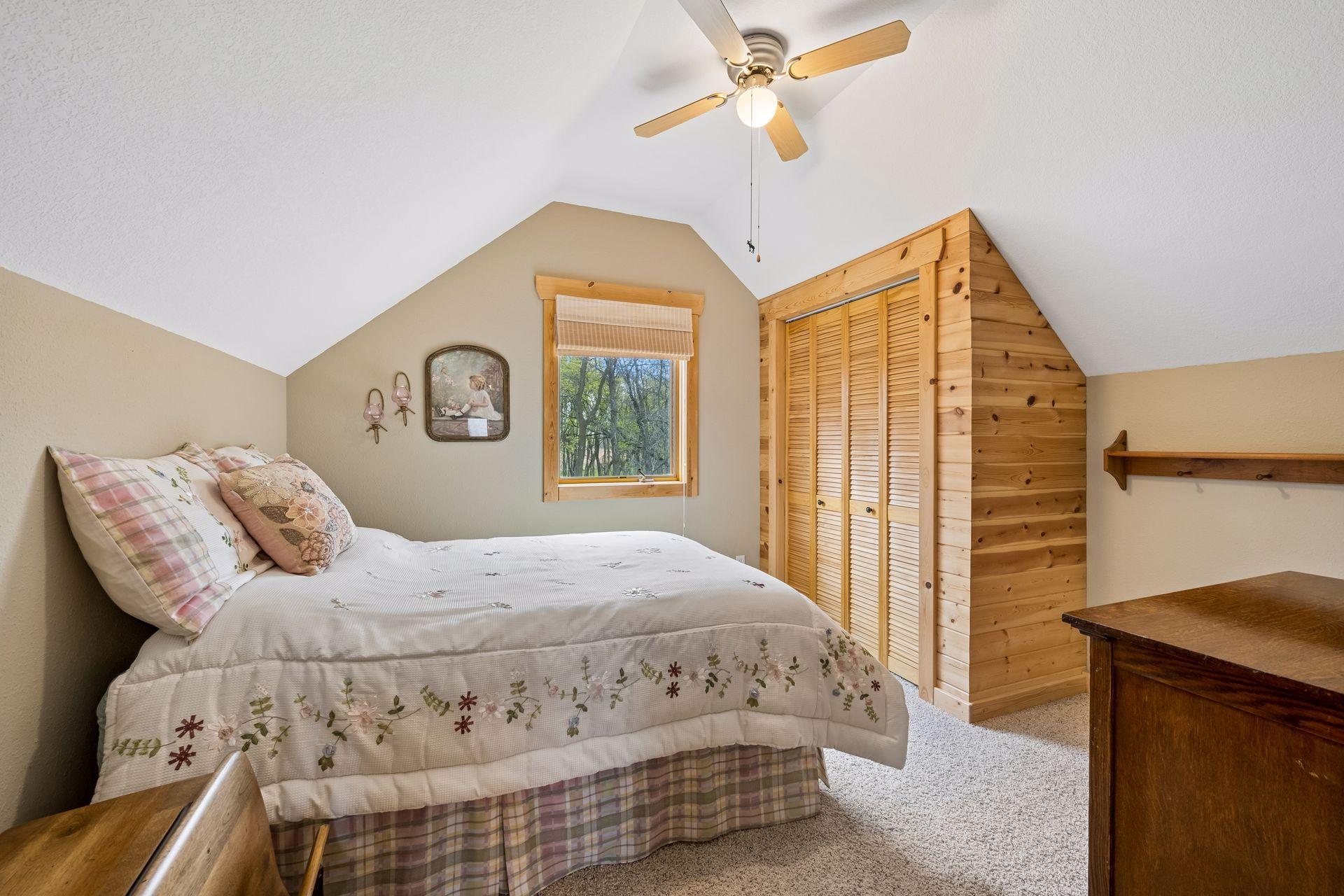 One of two upper loft bedrooms with vaulted ceiling.