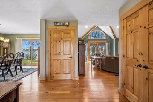Your view as you enter the home! Beautiful wood reclaimed plank floors, maple solid core doors, and a house filled with sunlight from all the windows to enjoy nature and the surroundings.
