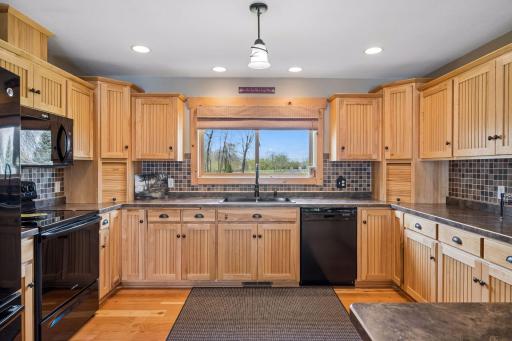 Love to cook or entertain? This kitchen is a dream providing space and open layout for all to be a part of the party or gathering.