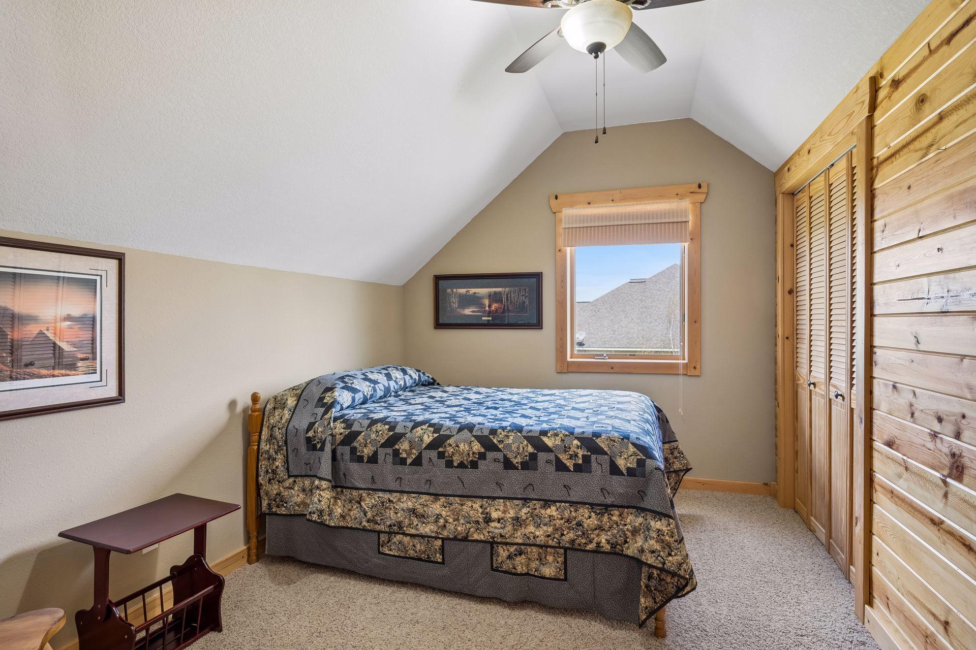 Second upper bedroom with vaulted ceilings.