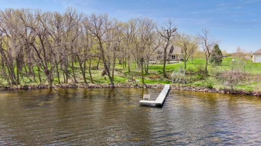 Escape to peaceful lakeside living in this beautiful Dassel retreat on Collinwood Lake. Towering trees, sparkling water views, a private dock, and cozy firepit. Enjoy relaxing mornings, sunset evenings as perfect blend of privacy and waterfront charm