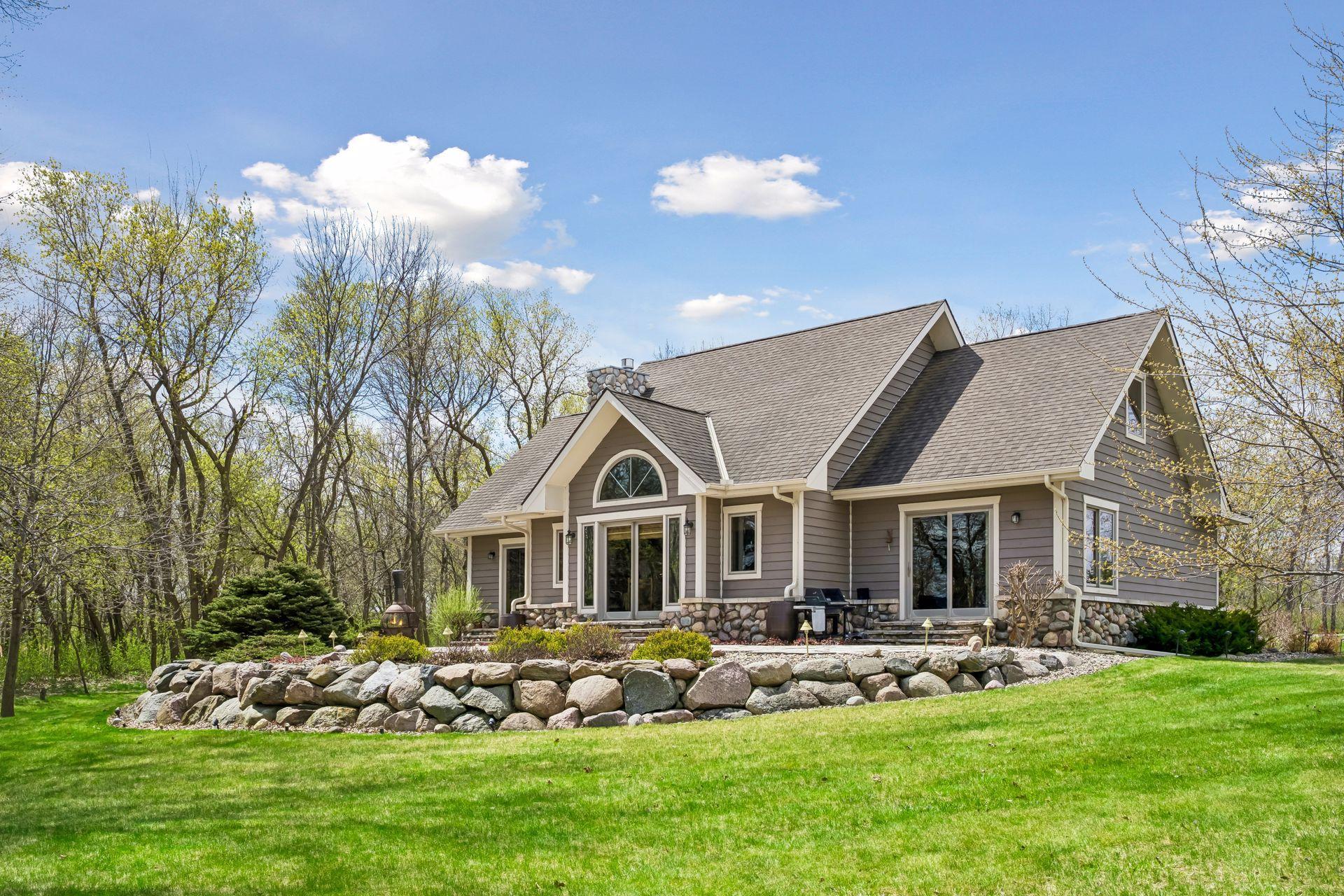Back of home has so many windows to enjoy the water views and privacy.