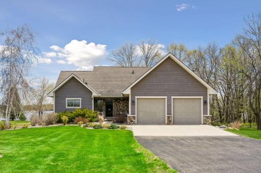 Welcome home to your close in Lake home only 52 minutes from DT Wayzata. Custom built with stone entry and front pillars and lush professional landscaping surrounds this property.