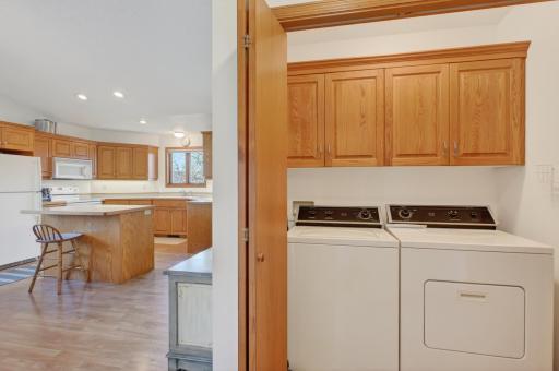 Main floor laundry with cabinets