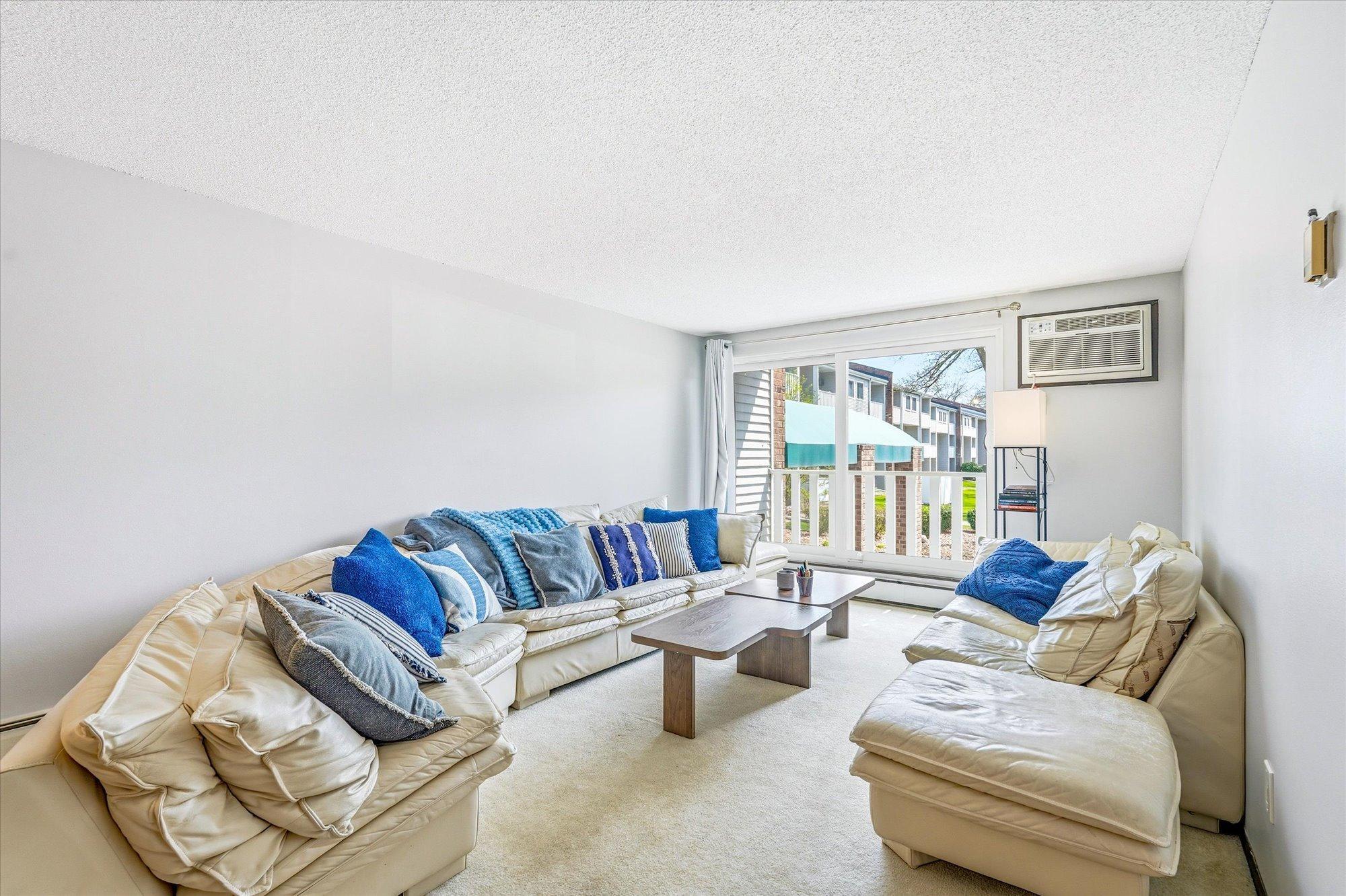 Living room with sliding glass door & deck