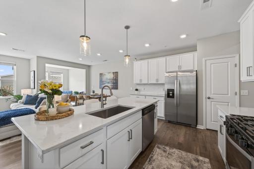 Kitchen features stainless steel appliances.