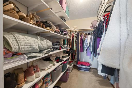 The walk-in closet keeps everything tidy with built-in storage and smart organization for your clothes and accessories.