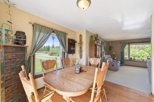 Gleaming hard surface floors flow throughout the dining area and kitchen.