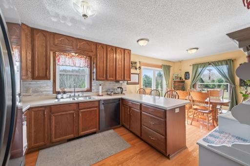 A kitchen window fills the space with natural light while offering peaceful views of the outdoors.