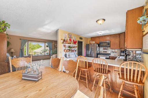 A convenient breakfast bar offers additional casual seating and doubles as a buffet for entertaining.