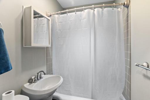 The main floor bathroom is located just off of the kitchen