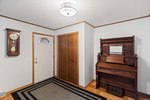 The entryway features a large coat closet
