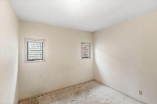 The office on the main floor is spacious and centrally located. The previous owner used it as a bedroom.