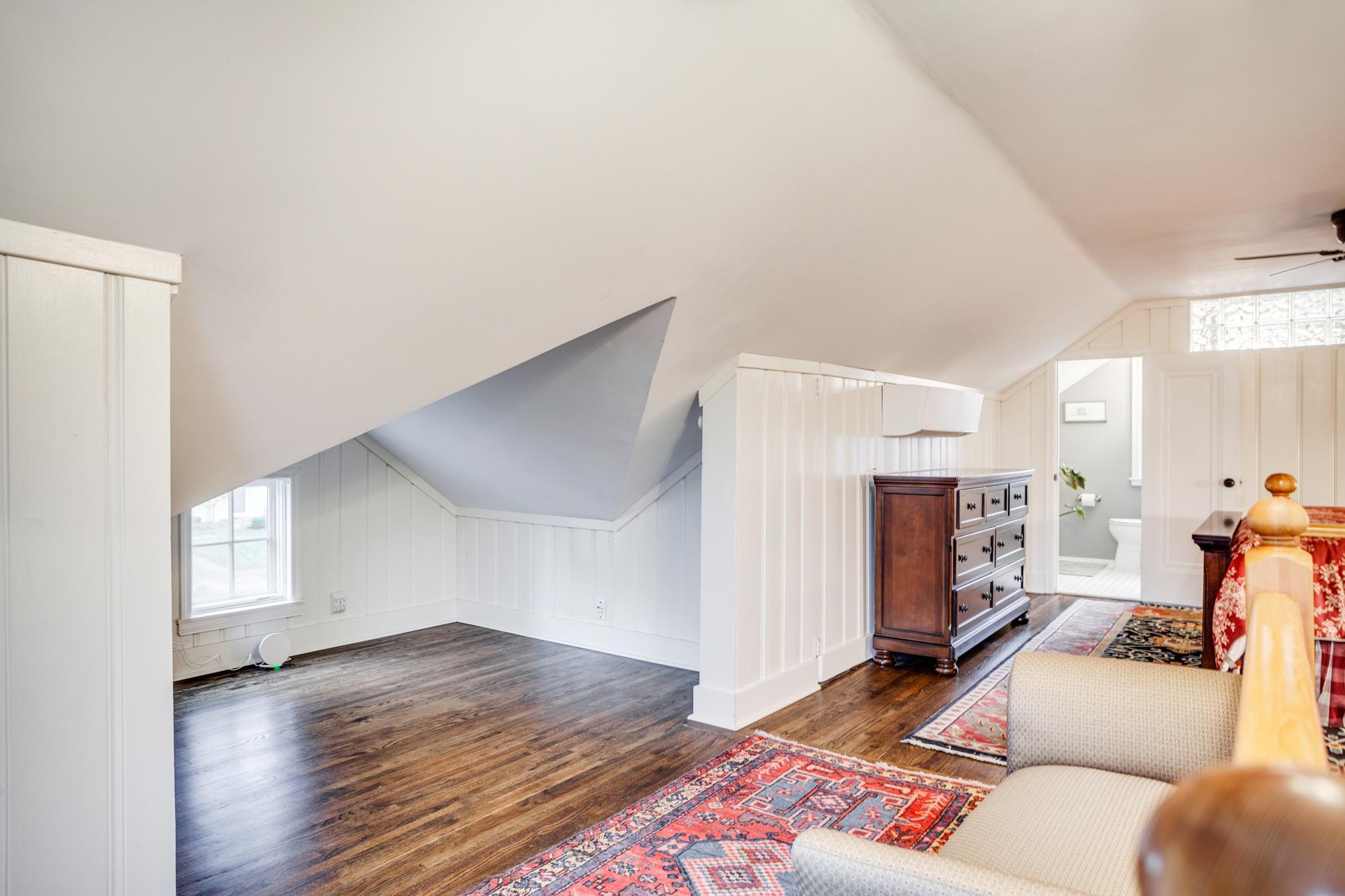 Thoughtfully designed, the upper level is wrapped in lovely shiplap accents and offers generous storage options along the eaves + a dedicated niche ideal for a desk or reading space.