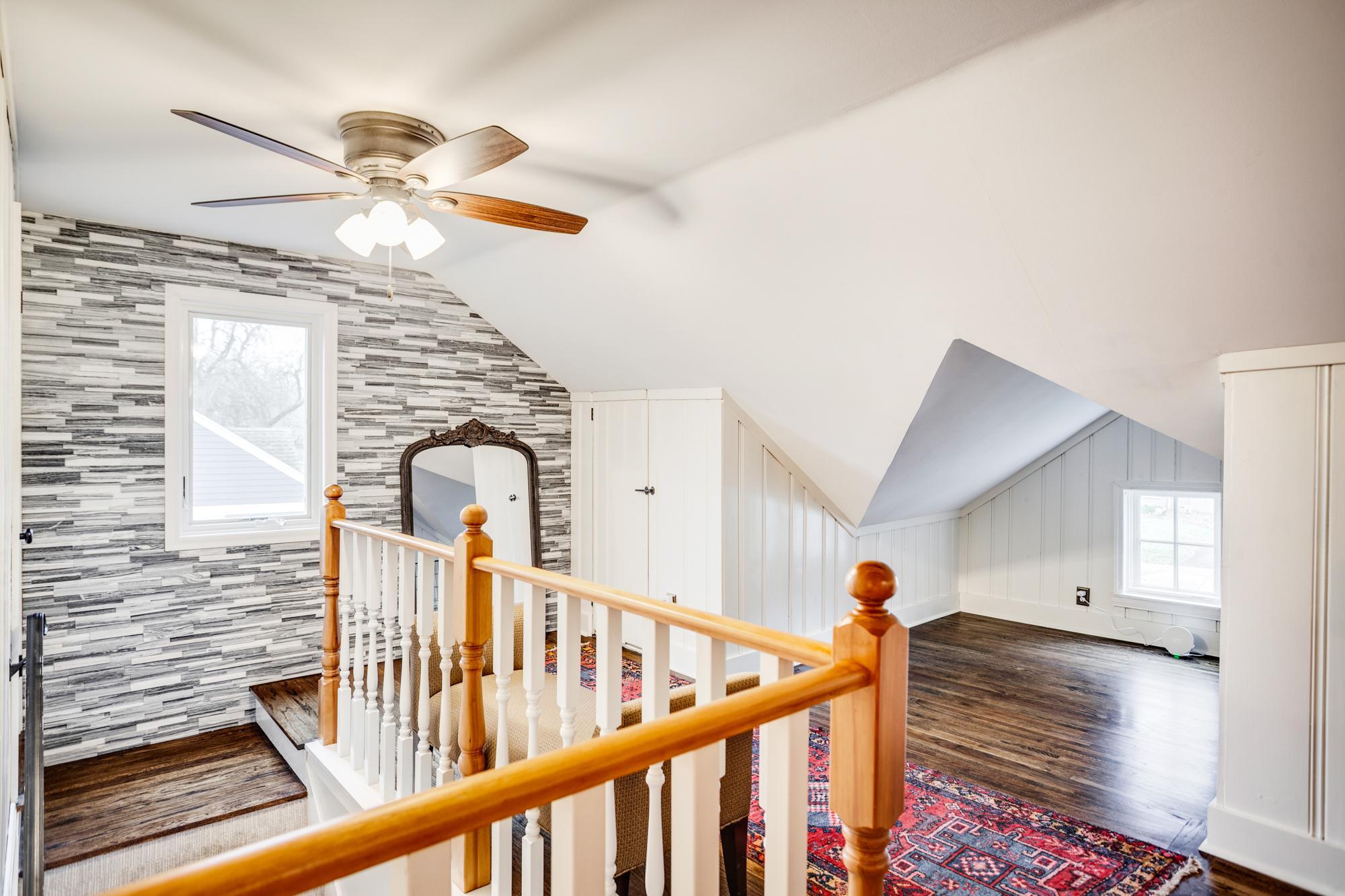 Added perks include a striking stacked stone accent wall at the top of the stairs, and a mini-split for all year comfort.
