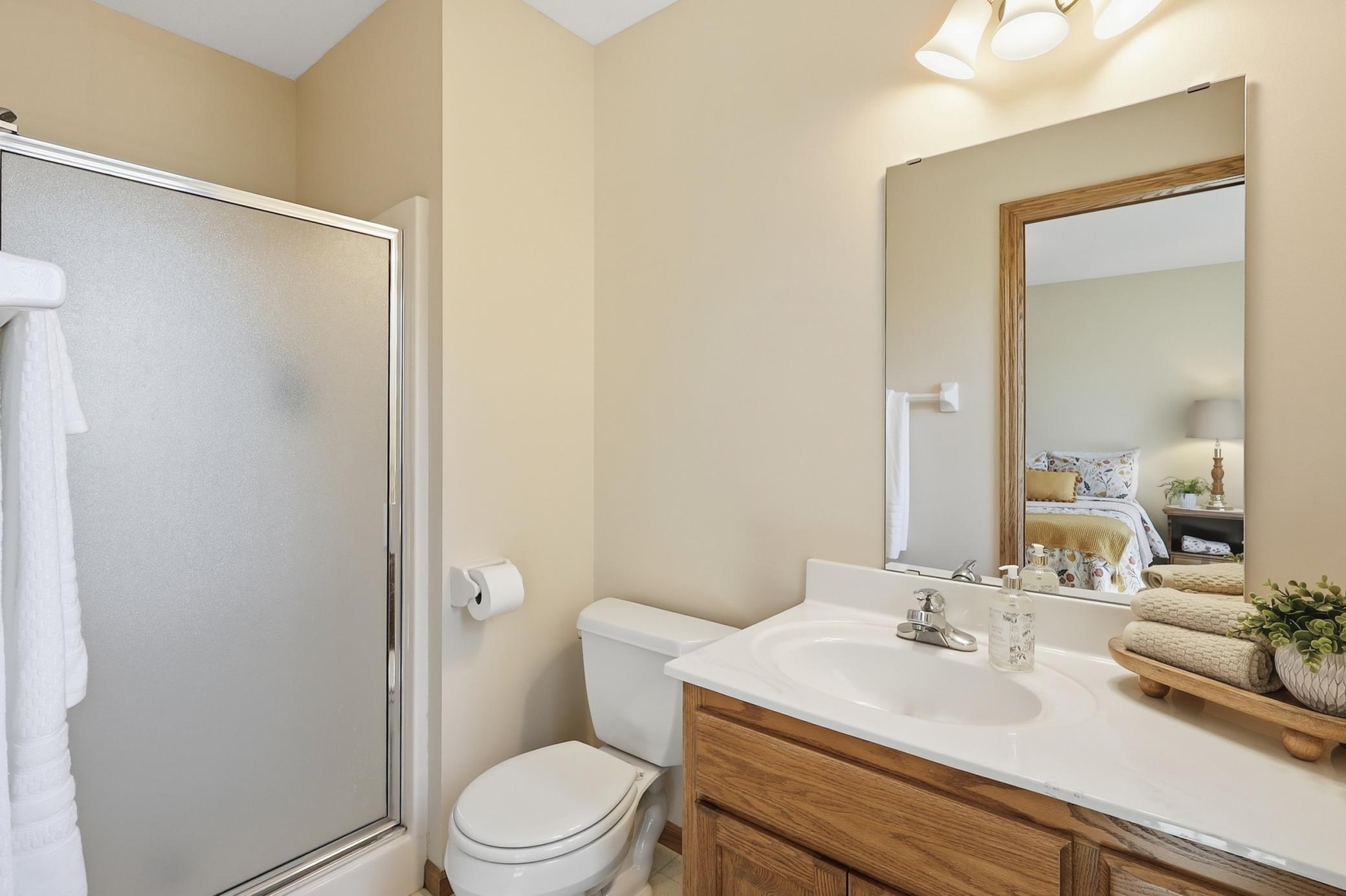 en suite bathroom and shower to bedroom