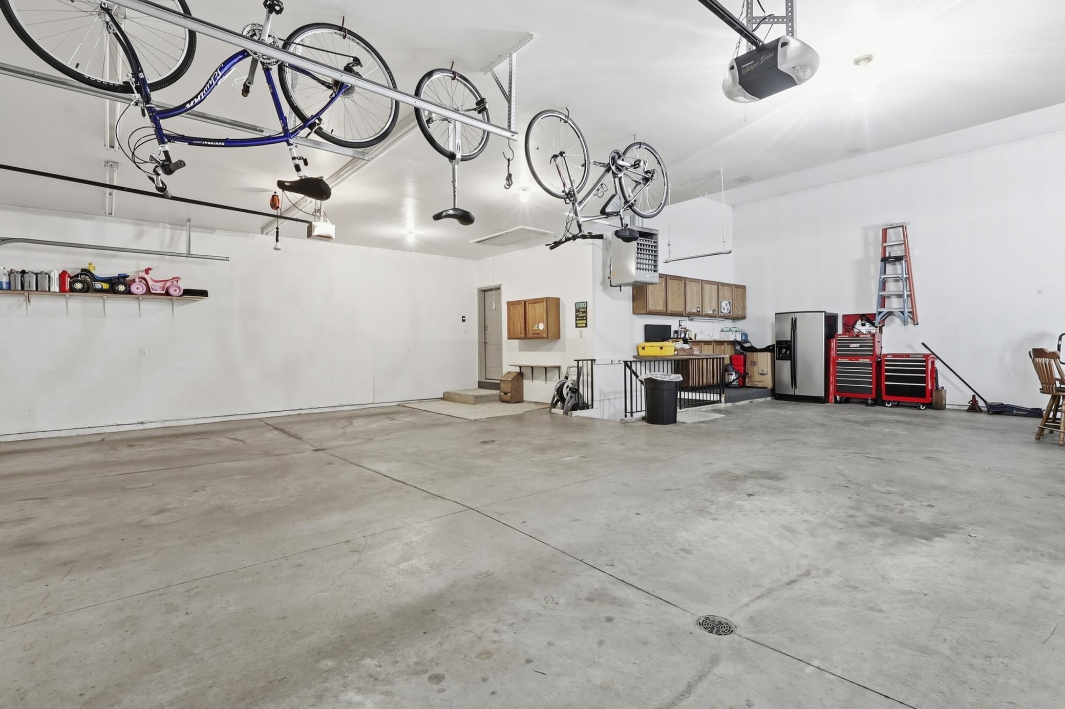 Attached Garage with stairs going to Lower Level