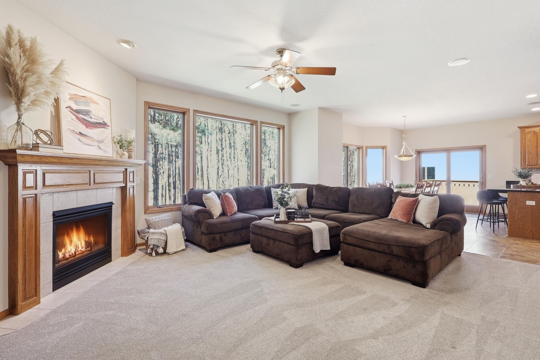 Cozy Living Room with gas fireplace and the best views out your expansive windows!