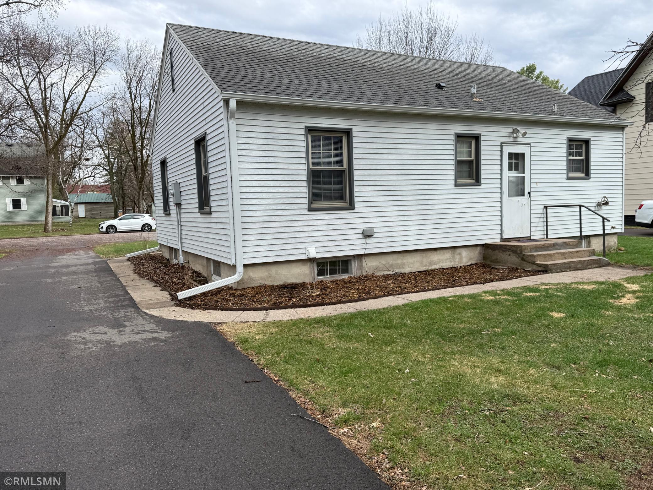 The yard is flat and has landscaping all around the house. There was a new tar driveway put in just last year.