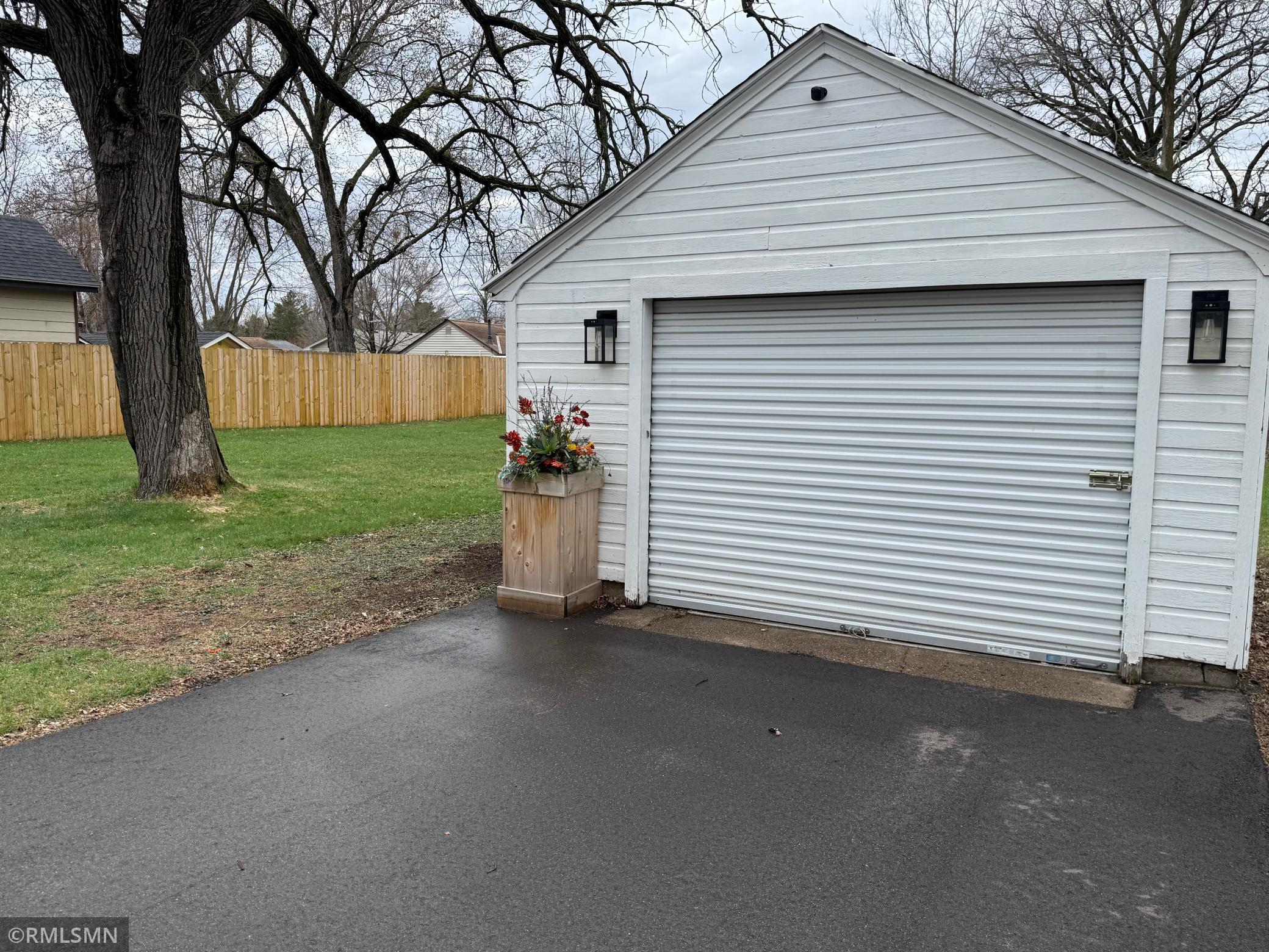 Just another garage space for a single car or all of your lawn and gardening equipment.