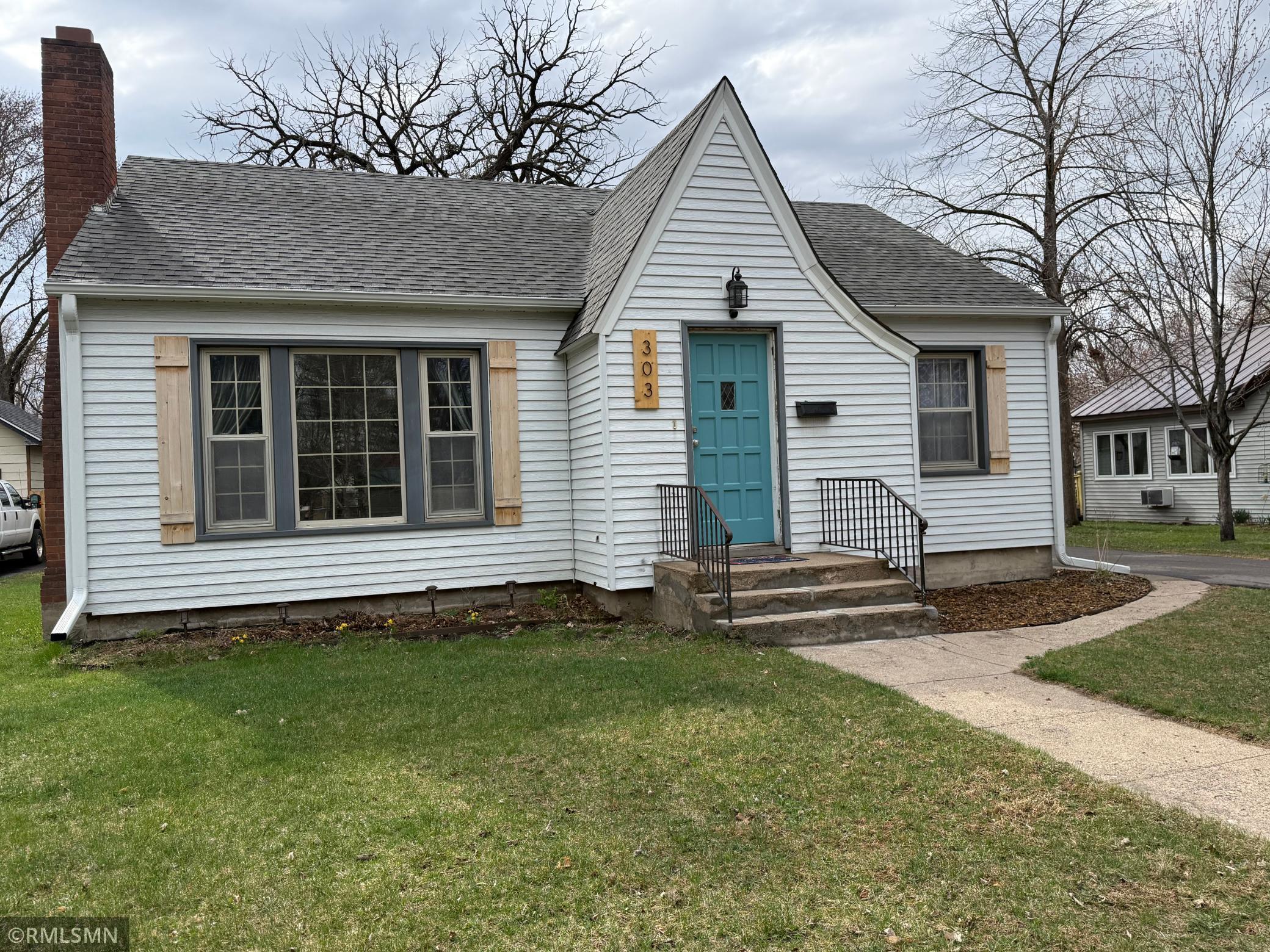 Charming rambler offering timeless curb, appeal in a peaceful neighborhood setting. This inviting property features classic white steel siding vinyl windows,and a welcoming front entry door with a pop of color. Just blocks from everything downtown
