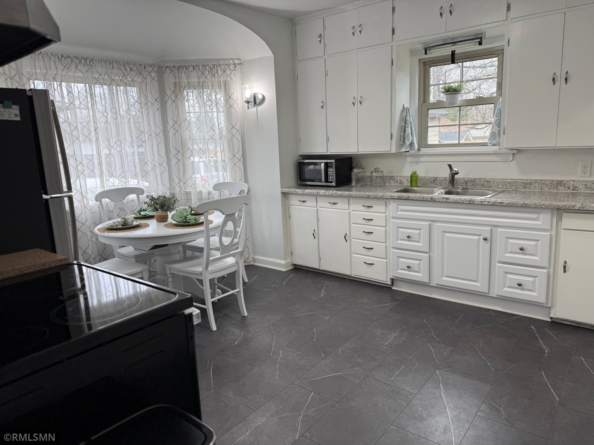 This kitchen is a blend of classic character and practical design. This kitchen is both comfortable and highly usable for daily living.