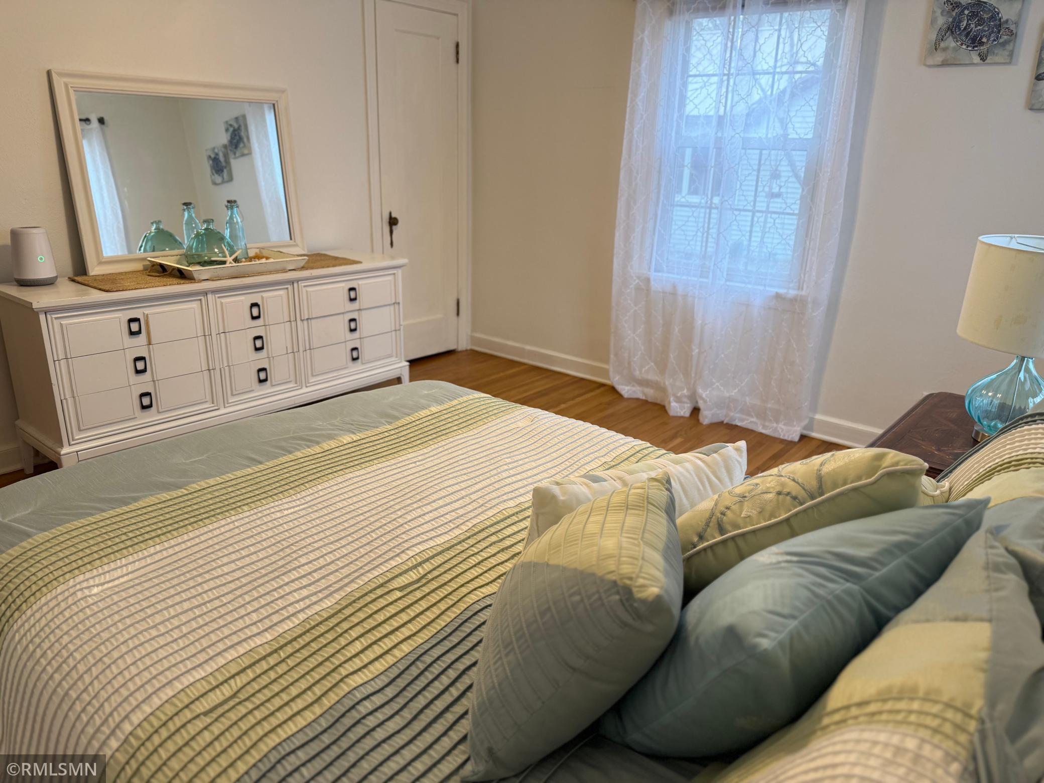 Bedroom number two main level this room is generously sized an apple space for queen or king bedroom set up along with additional room for dresser, reading, nook or workspace, clean lines and timeless finishes. Make this bedroom, move-in ready.