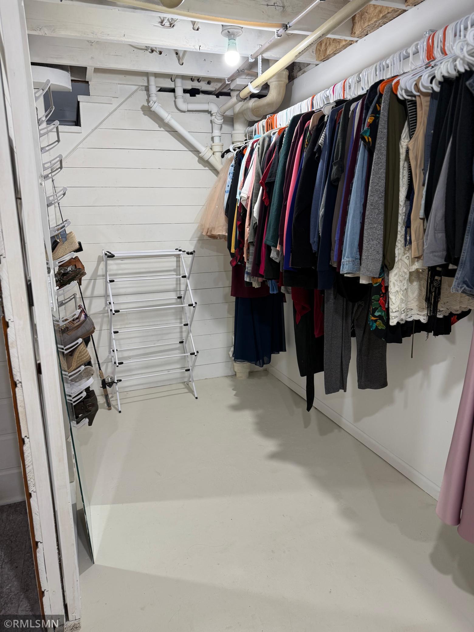 This side of the laundry room could easily be changed into a bathroom down the road. There’s also additional space for a third bedroom in this basement.