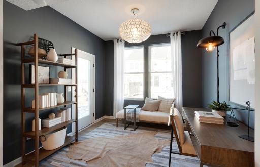 A welcome addition to any home.... This Ashton features our sunroom addition perfect for a home office, den, reading nook and any other uses you might have! Photo of model home.