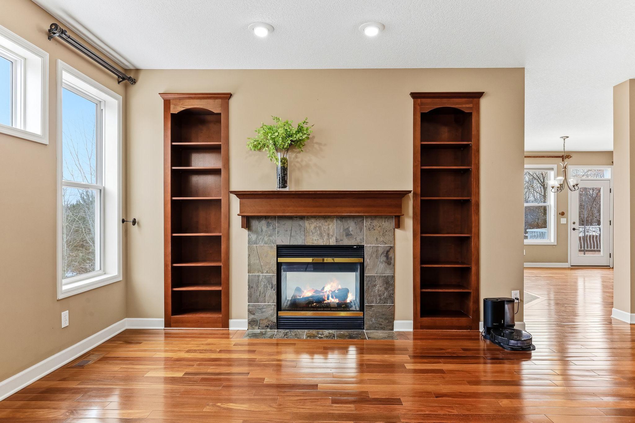 Two-sided fireplace of great room shared with the living area