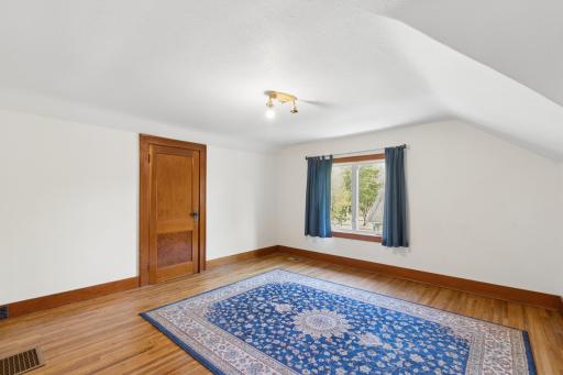 Upper level bedroom #3-through this door is an unfinished room would be great for a huge closet, playroom, office, endless possibilities!