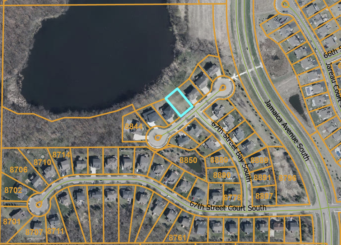 Aerial parcel map showing the lot (highlighted in blue) — positioned directly on the pond with cul-de-sac street access off 67th Street Bay South, Cottage Grove MN 55016. Surrounded by existing homes in a quiet, developed neighborhood.