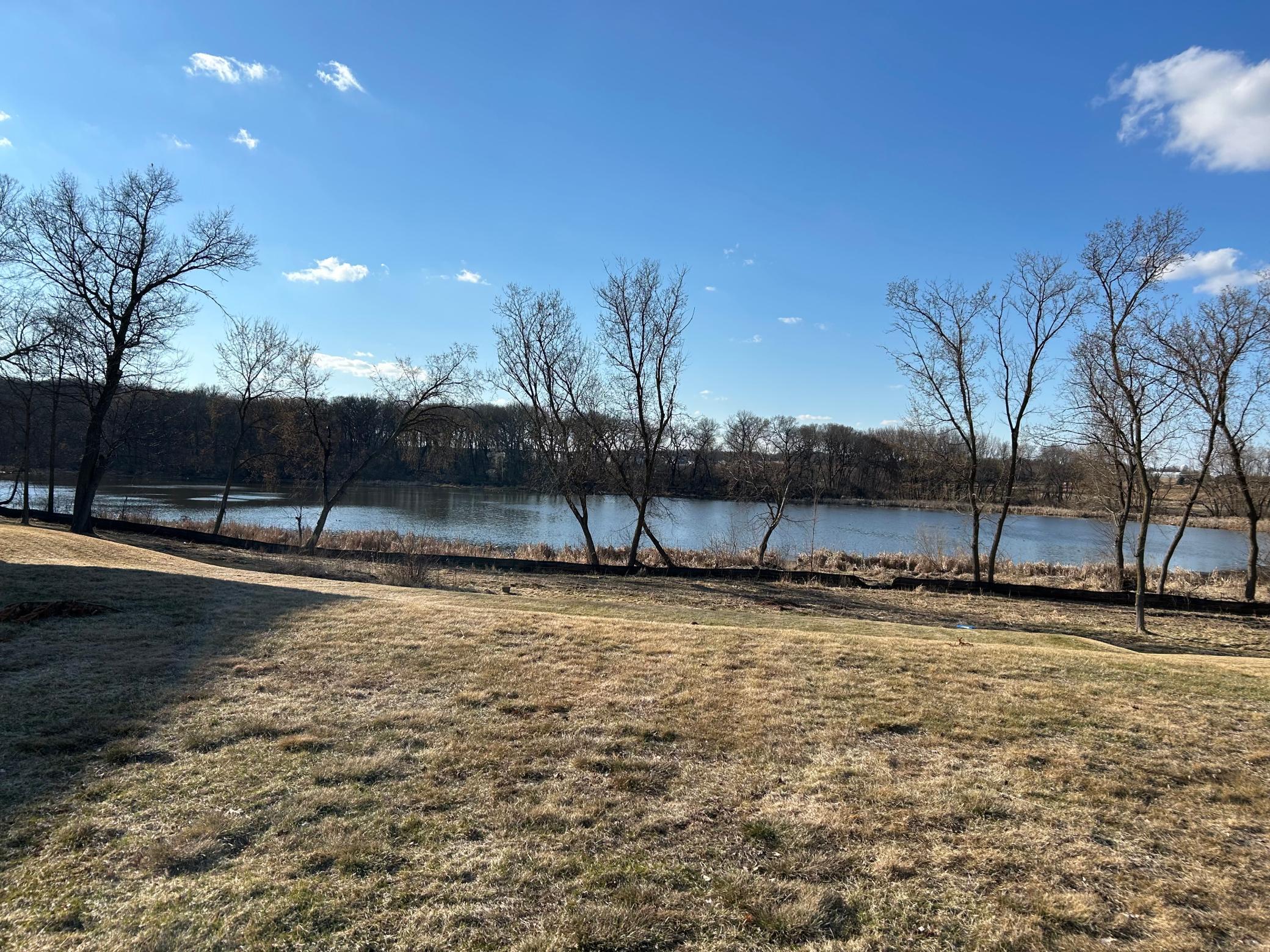 Unobstructed pond views from your future backyard. This level waterfront lot in Cottage Grove offers peaceful natural scenery and direct water frontage — build the walkout or lookout home you've always wanted. Eastridge schools.