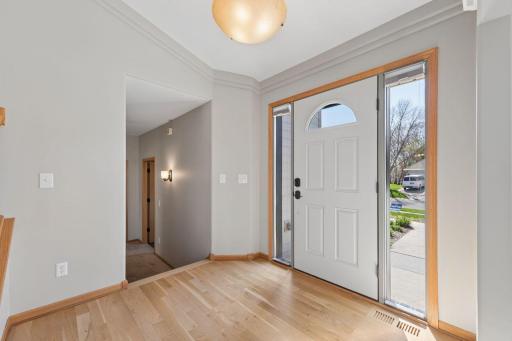 Spacious entry with side windows to the front door.