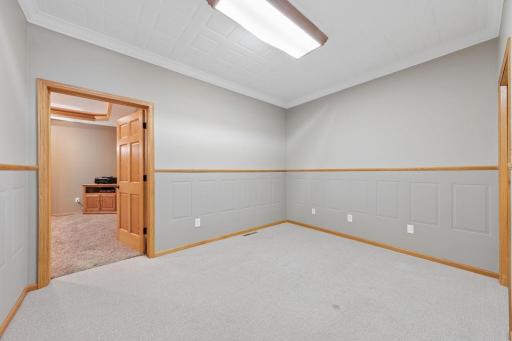 The main floor office leads into the family theater.