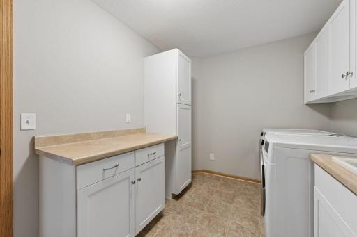 Additional storage and work space in the upper level laundry room.