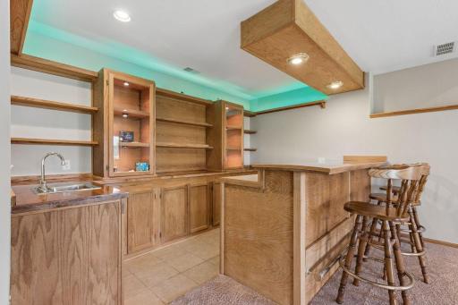Lower level wet bar with built in shelving.