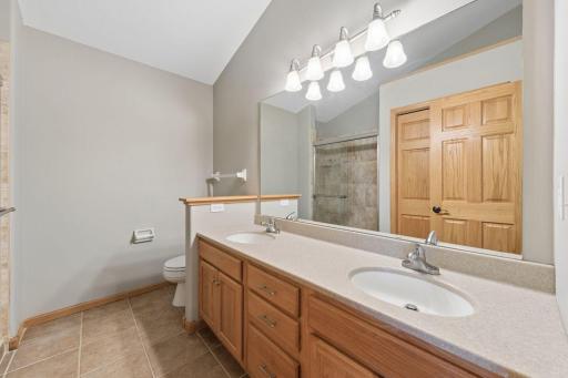 Owner's suite has dual sink and spacious vanity.