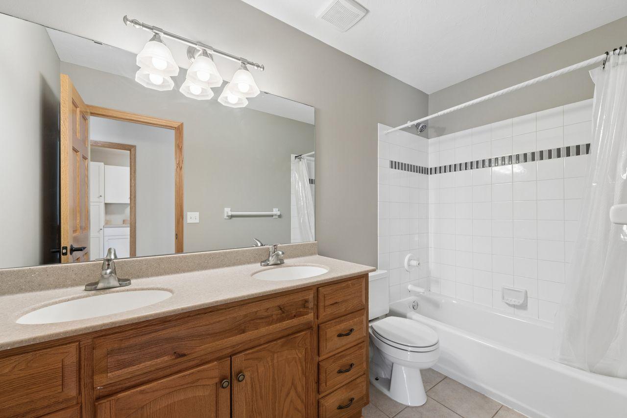 The upper level full bath has 2 sinks.