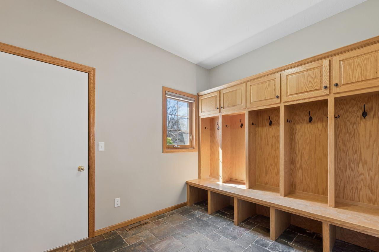 The mud room entry features tile floors and 5 lockers.