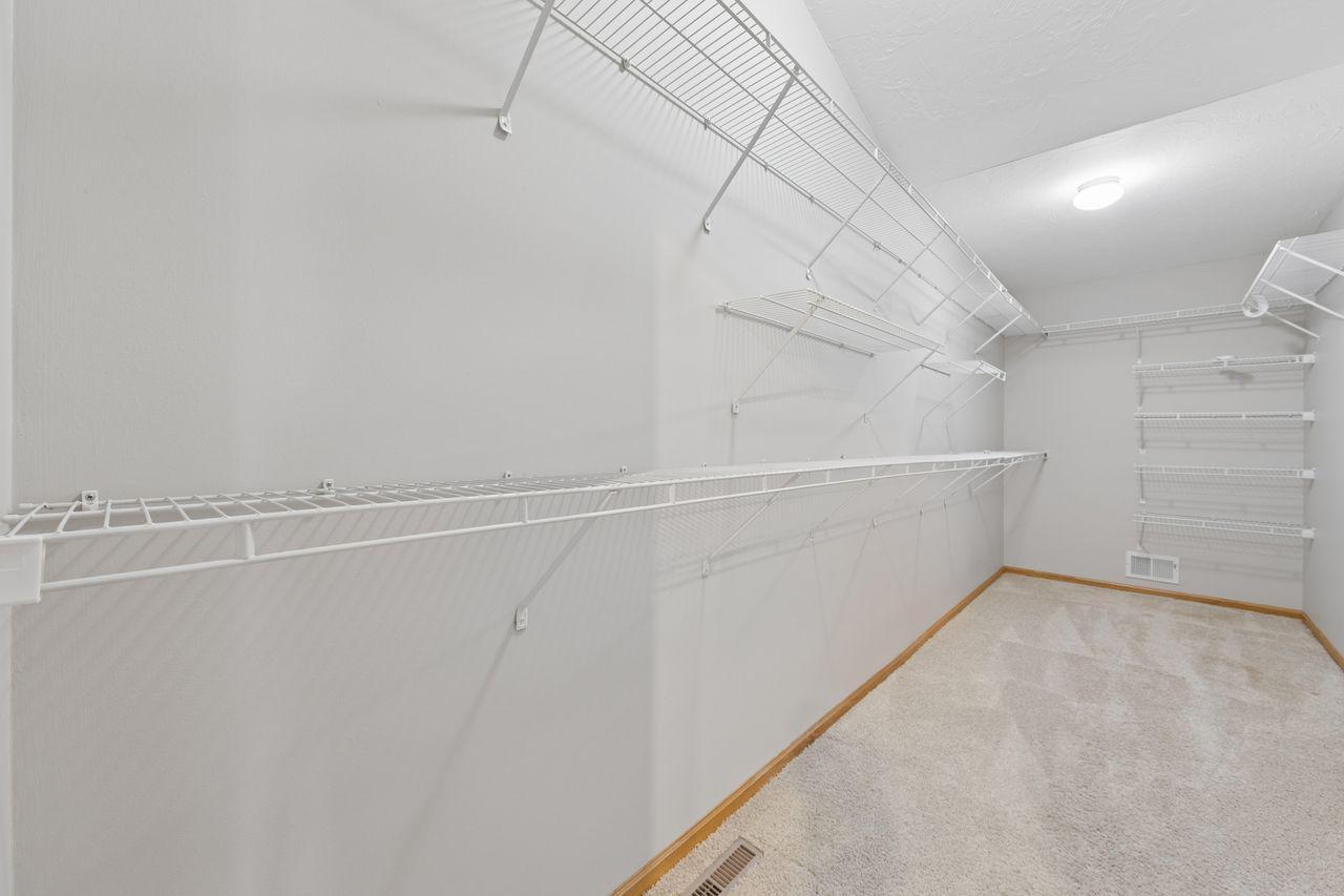 Deep owner's suite walk in closet.