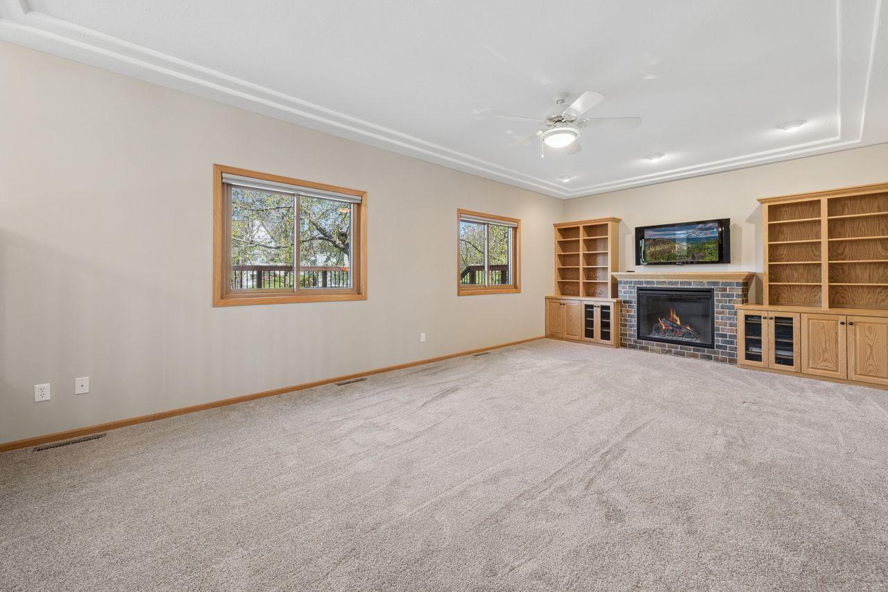 The family room features built in bookcases and gas fireplace.