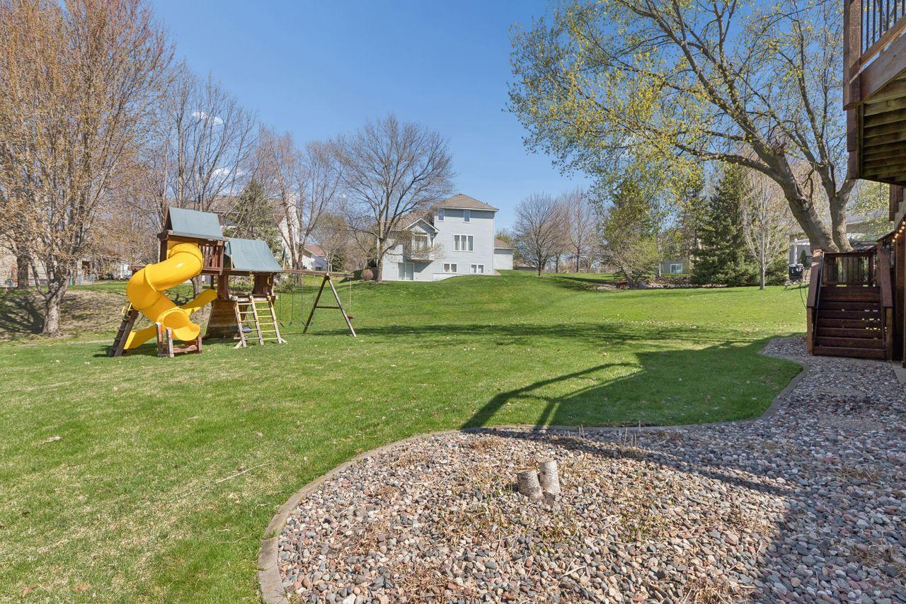 Large back yard offers privacy in the summer when the trees fill in. The children's play area is included.