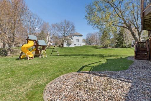 Large back yard offers privacy in the summer when the trees fill in. The children's play area is included.