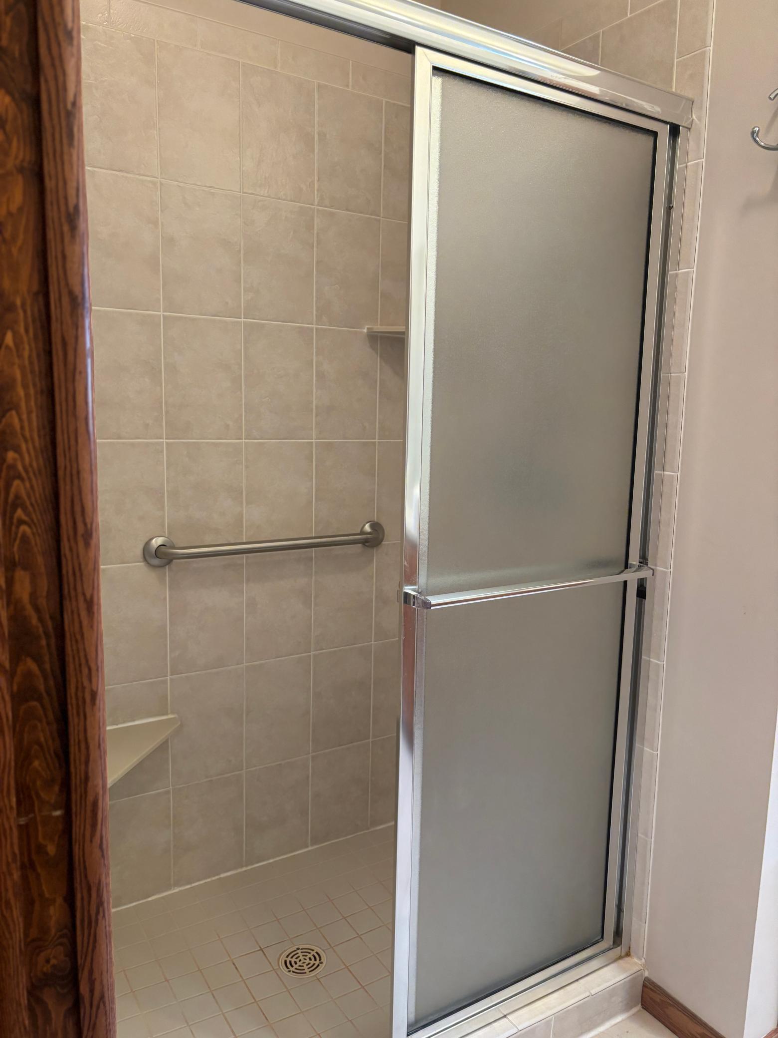 Primary Private Bathroom Shower with Grab Bars.jpg