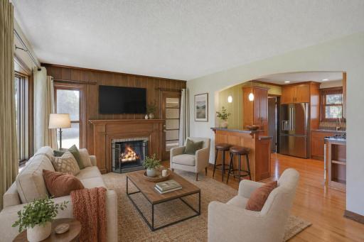 Step inside to character + charm; solid woodwork, bay window & fireplace in the living room. New bay window 2023 & new living room windows in 2020. Living room is virtually staged.