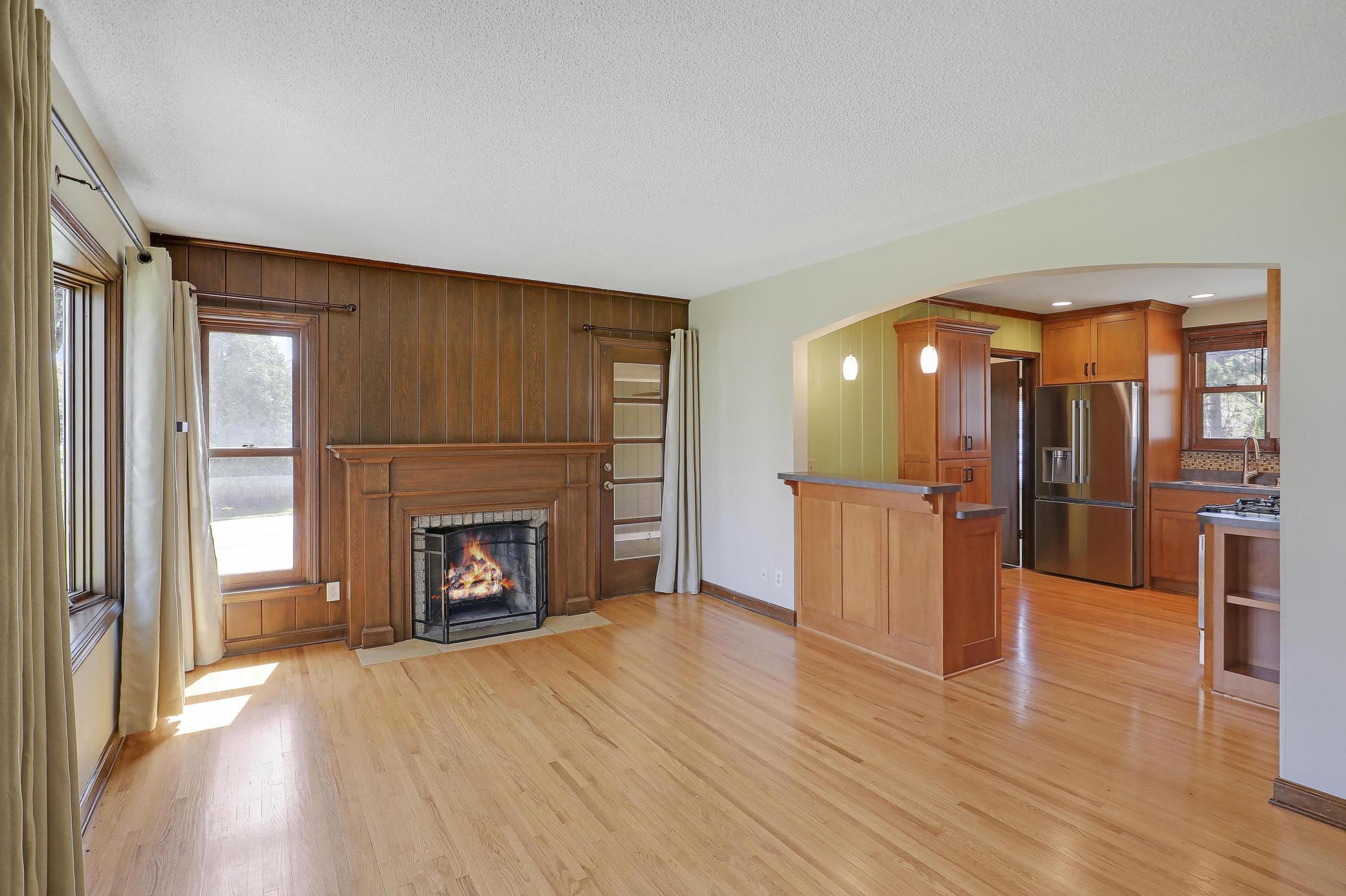 There is an access door to the breezeway/sunroom for convenience. The arch and breakfast bar invites your loved ones for a coffee chat.
