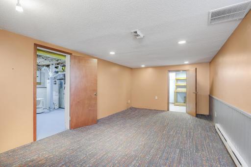 Family or rec room facing laundry & storage room